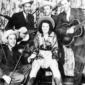Patti Page and the "Oklahoma Outlaws" pose for a photo.