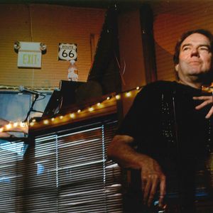 Double exposure image of Jimmy Webb performing at The Blue Door in 2006