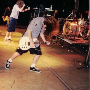 Jesse Davis of The Nixons performing on guitar