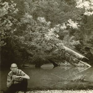 Albert Brumley posing by a creek in the early 1970's