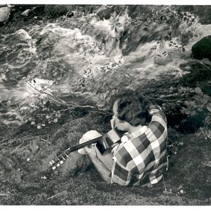 Mason Williams playing guitar beside Salt Creek in 1978