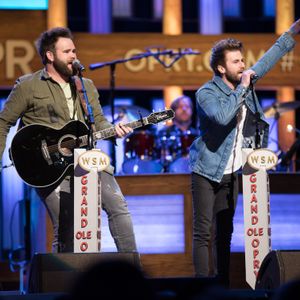 The Swon Brothers performing onstage at The Grand Ole Opry in 2017