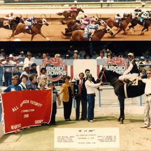 Jody Miller, pictured wearing a yellow jacket, posed for a photo with their winning horse after the All American Futurity Consolation Quarter Horse Race in Ruidoso Downs, New Mexico in 1986. Jody and her husband Monty's farm once had around 90 horses, and once Remington Park opened, the Brooks family stabled their designated race horses at the track.