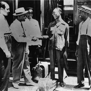 James Simpson, Charlie Christian and Eddie Christian at a train station in Oklahoma City.