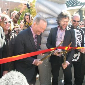 Ribbon Cutting ceremony for Flaming Lips Alley dedication: Left to Right - Roy Williams, President and CEO of the Greater Oklahoma City Chamber; Mick Cornett, OKC Mayor; Wayne Coyne, The Flaming Lips; Michael Ivins, The Flaming Lips; Burns Hargis, then Vice Chairman of Bank of Oklahoma, now President of Oklahoma State University.
