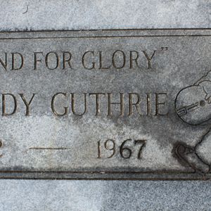 A memorial marker for Woody Guthrie, who is not actually buried here, at Highland Cemetery in Okemah.