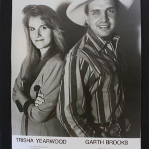 Country stars Trisha Yearwood and Garth Brooks pose together in a promotional photo.