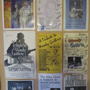 Woody Guthrie tribute posters on the wall at The Blue Door