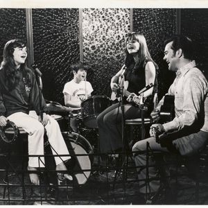 Conway Twitty sings with his children, Jimmy, Kathy and Joni, in the family music room at their home in Moore, Oklahoma.