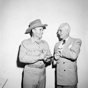 Bob Wills signs an autograph around the height of his popularity in the 1940s.