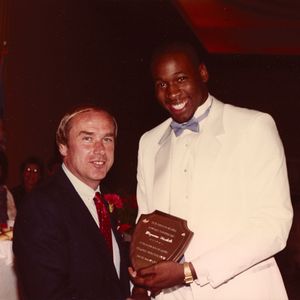 Former Oklahoma University men's basketball coach Billy Tubbs posing with Wayman Tisdale when Wayman was presented with the Freshman All American Award