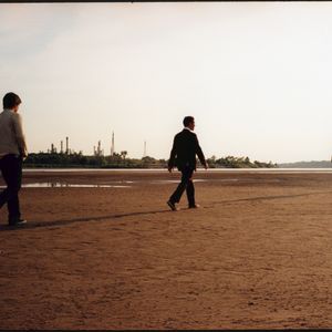 The Hanson brothers walk along the Arkansas River in Tulsa during a 2007 photo shoot for "The Walk," their fourth studio album. 