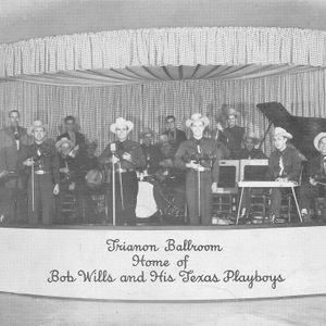 Eldon Shamblin, Lucky Moeller, Bob White, Tiny Moore, Jimmy Widener, Bob Wills, Billy Jack Wills, Johnny Gimble, Keith Coleman, Luke Wills, Mancel Tierney, Herb Remington and John Wills perform live in 1949 at the Trianon Ballroom in Oklahoma City.