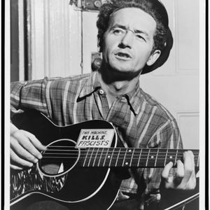 Woody Guthrie was known for political lyrics and the note on his guitar, which reads, "This machine kills fascists."