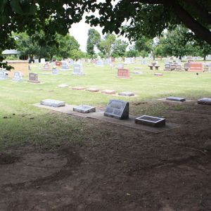 The Woody Guthrie family plot is located in Highland Cemetery in Okemah.