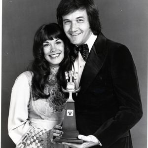 Roger Miller poses with one of his three Academy of Country and Western Music Awards he earned throughout his career.  