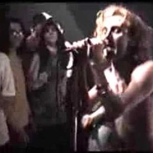 Tyson Meade singing at a 1990 Chainsaw Kittens performance at Rome in Norman, Oklahoma