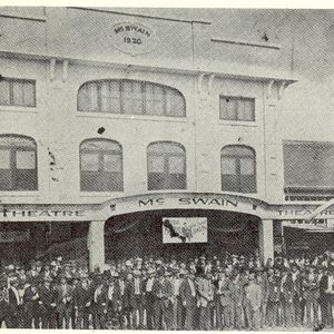 A group gathers outside the McSwain Theatre in the early 1920's to celebrate a performance