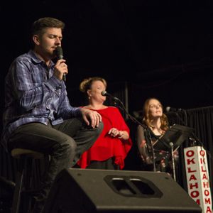 Owen Pickard hosts and sings at the Oklahoma Opry in October 2017 with Cindy and Kelcie Scarberry providing harmonies.