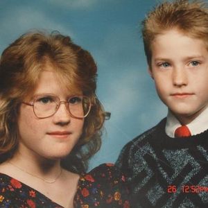 Chris Gaylor and his sister Emily pose for a family photo.