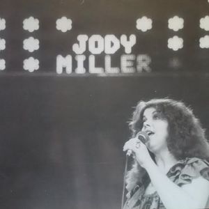 Jody Miller's name appears in lights as she performs in Rotterdam, Netherlands at the Holland Country Festival, 1978