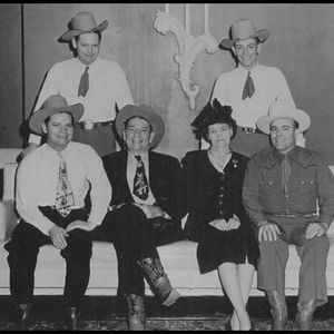 Bob Wills poses for a family portrait with his brothers and parents.