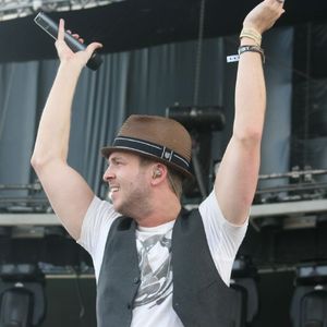 Frontman Ryan Tedder of OneRepublic performing on stage in 2009.
