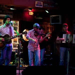 John Fullbright (far right) playing accordion with the Turnpike Troubadours at Eskimo Joes in Stillwater, Oklahoma in 2009