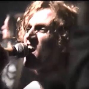 Tyson Meade performing at a 1990 Chainsaw Kittens show at Rome in Norman, OK