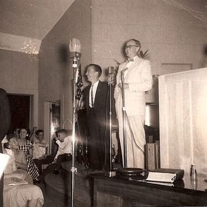 Albert Brumley laughing onstage