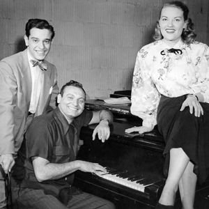 Singers Frankie Laine (at piano), Patti Page and Richard Hayes pose for a photo. The three vocalists were recording for Mercury Records in the early 1950s. 