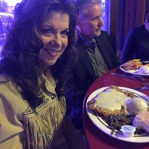 Jody Miller enjoys the famous chicken fried steak dinner at Kendall's Restaurant in Noble, Oklahoma. Kendall's features displays of Oklahoma memorabilia including Jody Miller album art.
