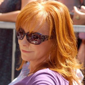 Reba McEntire looks on as fellow Oklahoman Vince Gill receives a star on the Hollywood Walk of Fame in September 2012.  McEntire, who spoke during Gill's ceremony, received her own star on the illustrious walk in 2008.