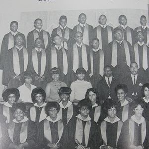 Ronnie Wilson appears on the third row, fourth from the left with the rest of the school choir. 