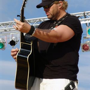 Country singer Toby Keith sings at a United Service Organization (USO) sponsored concert held at Naval Support Activity, in Gricignano, Italy.