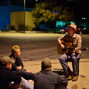 John Fullbright playing on the sidewalk in front of Frank & Lola's cafe in Bartlesville, Oklahoma in 2010. John had a new guitar and there were problems with the pickup, and it was too noisy in the bar for him to play without amplification. It was unseasonably warm that night, so guests went outside for this unplugged performance.