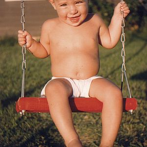 Young Vince Gill swings outside his Oklahoma City home.