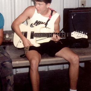 Joe Don Rooney practices guitar as a teenager