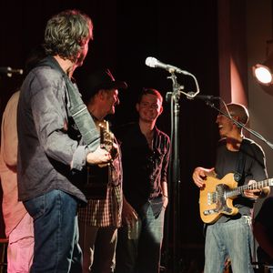 John Fullbright onstage with Sam Baker, Butch Hancock and Don Conoscenti at the Crystal Theater in Okemah, Oklahoma during the 2012 WoodyFest
