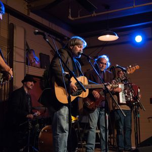 Left to right: John Cooper, Giovanni Carnuccio III, Tom Skinner, Don Morris and TZ Wright perform at the Woody Guthrie tribute show at the Blue Door in 2012.