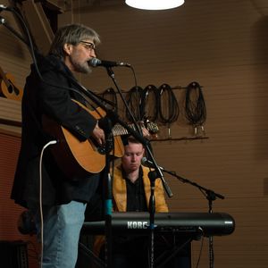 Tom Skinner performs with John Fullbright at the 2014 Woody Guthrie Tribute Show at the Blue Door.