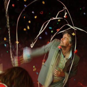 The Flaming Lips often perform live with confetti and costumes.