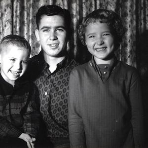 Vince Gill (left) and his siblings smile for the camera at their grandparents' house in Yukon.