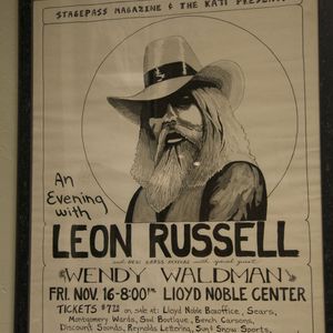 A poster advertises an appearance by Leon Russell at Lloyd Noble Center in Norman.