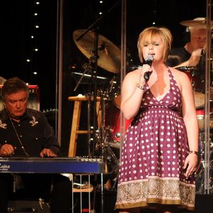 A band performs onstage at the Oklahoma Opry.