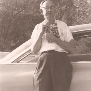 Albert Brumley holding a songbook