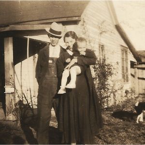 Albert Brumley and his wife Goldie with their first born son, Bill, in 1934