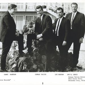 Tommy Markham, Conway Twitty, Lou Huston and Joe E. Lewis, also known as Conway Twitty and The Twitty Birds, one of Conway's early bands, pose outside of Conway Twitty Enterprises in Oklahoma City.