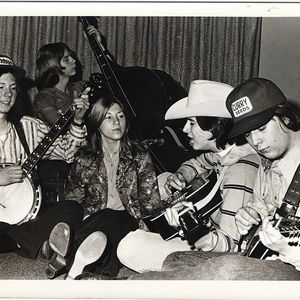 Vince Gill (wearing the cowboy hat) and his band, The Bluegrass Revue, practice in Gill's Oklahoma City living room.