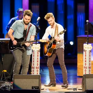 The Swon Brothers performing onstage at The Grand Ole Opry in 2016